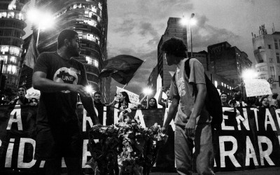 Attention call: protesters carrying a turnstile that will be burnt, Belo Horizonte, Brazil, 2014.