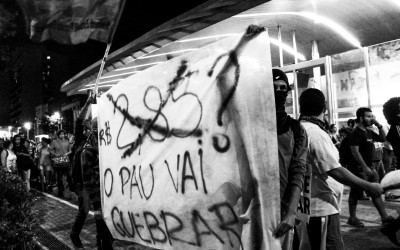 Students showing posters in public,  reclaiming for  free tariff in public transports, Belo Horizonte, Brazil, 2014.