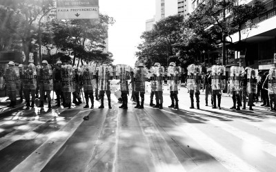 Police  barrier to contain protesters. frightened residents in central region, Belo Horizonte, Brazil, 2014.