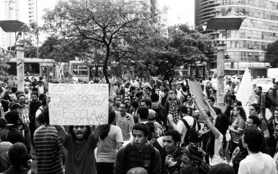 Students showing posters in public,  reclaiming for  free tariff in public transports, Belo Horizonte, Brazil, 2014.