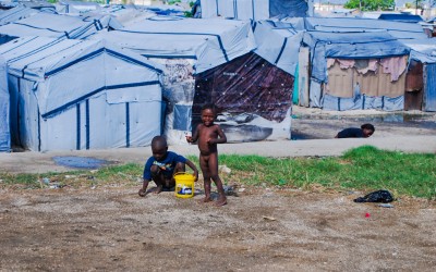 Displaced Camp Parc Jean Marie Vincent.  Residents of camps like this live with fear and terror, especially women, who are often victims of rape or threats. Port-au-Prince, Haiti, 2012.
