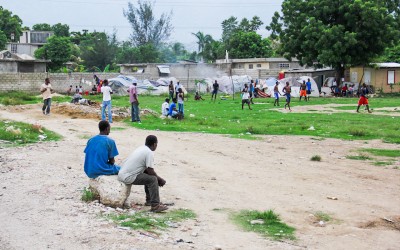 In an area of Port-au-Prince residents improvise dwelling tents and football pitch. According to the MINUSTAH military - UN Mission in Haiti - in times more troubled and violent were bodies being thrown into space and children playing with parts of unknown bodies, 2012.