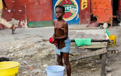 To survive or help support their families many children work heavy on domestic services when they should live their childhoods and study. Port-au-Prince, Haiti, 2012.