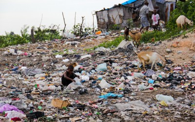 To survive, residents look for contaminated food or objects that can be sold to ensure survival. In activities like this the contamination by the garbage is inevitably. Port-au-Prince, Haiti, 2012.