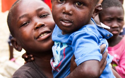 Two years after the earthquake that destroyed the country and made thousands dead, including parents and mothers, orphans rely on their brothers and in the families of friendly friends to continue their lives and recreate routines. Port-au-Prince, Haiti, 2012.