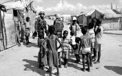 Sometimes journalists and UN Officers talk with the community seeking improvements. Parc Jean Marie Vincen, Port-Au-Prince, Haiti, 2012.