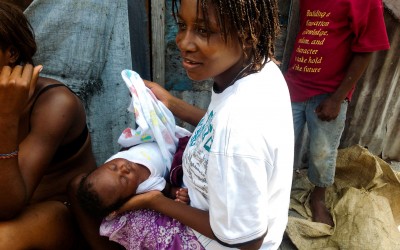 Hairdresser in Jean Marie Displaced Camp, Port-Au-Prince, Haiti, 2012.