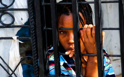 Brave woman with blood in her eyes after a Vudu religious ritual. Cité Soleil, Port-Au-Prince, Haiti, 2012.