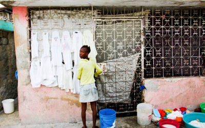 Washerwoman and homemaker in Cite Soleil, Port-Au-Prince, Haiti, 2012.