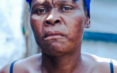 Hairdresser in Jean Marie Displaced Camp, Port-Au-Prince, Haiti, 2012.