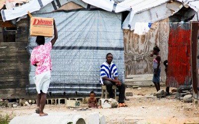 In Haiti, women usually work while men take care of their children. Port-Au-Prince, Haiti, 2012.