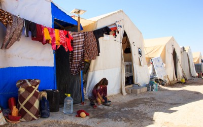 Yazidi girl does housework while she should be studying or playing. Sharia Refugee Camp, near Duhok, Iraq (Iraqi Kurdistan).