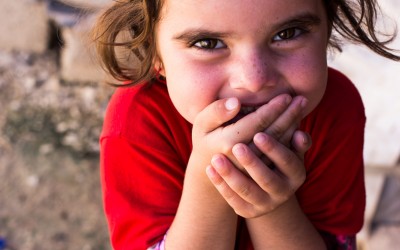 Child returns to the Sharia Refugee Camp after being taken by the Islamic State (ISIS). This refugee camp shelters nearly 9000 families from the religious minority Yazidi, and many times one can find children like this one, who cannot speak. This happens because dozens of them were captured and, many times, hurt and traumatized by the ISIS when the Jihadist group invaded (in 2015) the great city of Mount Sinjar,  Duhok, Iraq (Iraqi Kurdistan).