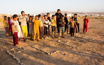 Children use stones to write a message to the world, asking for PEACE. The civilian population, especially the children, try to resist to the consequences of these conflicts for the independence of Kurdistan and the violence posed by ISIS. Many people were captured and executed. More than 4 million civilians abandoned their houses trying to escape the terror. More than 1,5 million refugees and displaced persons live in refugee camps to preserve their identities, Duhok, Iraqi Kurdistan, 2015.