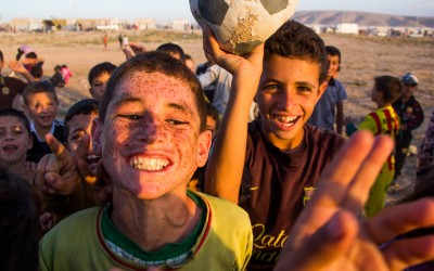 Children playing soccer in the Sharia Refugee Camp. Already in their adolescence, many children can already understand what is happening with their families. Consequently, many of their dreams become harder to come true. Nevertheless, with a contagious happiness they keep showing that one needs to believe that a positive change will come, and that they might even become professional soccer players, Duhok, Iraqi Kurdistan, 2015.