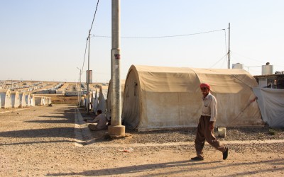 Civilians who had their homes, families and professions after the Islamic State have to contend with the new shared tents, food and utensils offered by NGOs, and try to rebuild life again in the midst of chaos. Refugee Camp Cover II, near Duhok, Iraq (Iraqi Kurdistan).