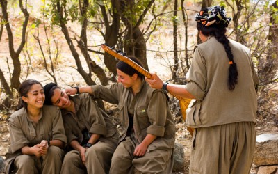 During a break from combat training, young girls of the Kurdish Worker’s Party (PKK) sing Kurdish traditional songs. Considered as a terrorist group by the North Atlantic Treaty Organization (NATO), the PKK is seen by the Kurds as an ally on the fight for the independence of Kurdistan and against the violence of Islamic State (ISIS). Furthermore, the PKK strives to ratify the cultural, economical and political rights, and promotes the empowerment of women in the Middle East. Qandil mountains, Iraq (Iraqi Kurdistan), 2015.