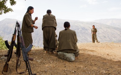 Small group of the Kurdish Worker’s Party (PKK) guerrillas braiding each other’s hairs. After their daily training, and after studying politics and philosophy and manufacturing their own food, the PKK women perform a rite based in strengthening their ties, relaxation and humility. Qandil mountains, Iraq (Iraqi Kurdistan), 2015.