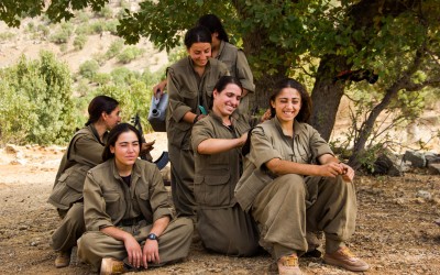 Small group of the Kurdish Worker’s Party (PKK) guerrillas braiding each other’s hairs. After their daily training, and after studying politics and philosophy and manufacturing their own food, the PKK women perform a rite based in strengthening their ties, relaxation and humility. Qandil mountains, Iraq (Iraqi Kurdistan), 2015.