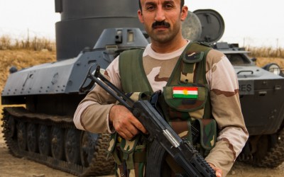 Foreign Peshmerga prepares to fight near the base, which had just recovered a war tank used by Islamic State (ISIS). Iraq (Iraqi Kurdistan), Middle East, 2015.