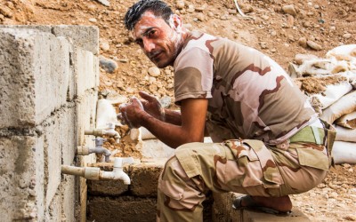Peshmerga in his moment of personal hygiene. Even though almost always precarious conditions, the combatants fight with all the energy and dedication so that the legacy of the Islamic State (ISIS) finishes. Iraq (Iraqi Kurdistan), Middle East, 2015.