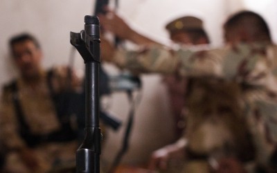 Commander of the Peshmergas show off their weapons while discussing new strategies against the Islamic State (ISIS). Also known as Daesh, extremists are increasingly violent and desperate to gain more space. Iraq (Iraqi Kurdistan), Middle East, 2015.