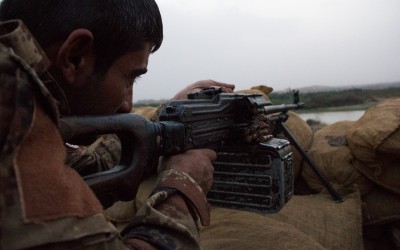Fight for Mosul from a Peshmerga base. Motivated by the importance of getting back the second largest Iraqi city commanded by the ISIS, the Peshemergas risk their lives and battle with outdated military equipment. Their snipers position themselves with soviet riffles from the 60’s, behind the improvised trenches made of dirt and rubble, as if it was the First World War, near Mosul, Iraq (Iraqi Kurdistan).
