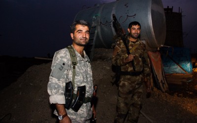 Without advanced equipment and technologies, such as infra red, to aid in night battles, the Peshmergas defend and attack with old rifles behind improvised water boxes and other objects and materials at the bases, near Mosul, Iraq (Iraqi Kurdistan).